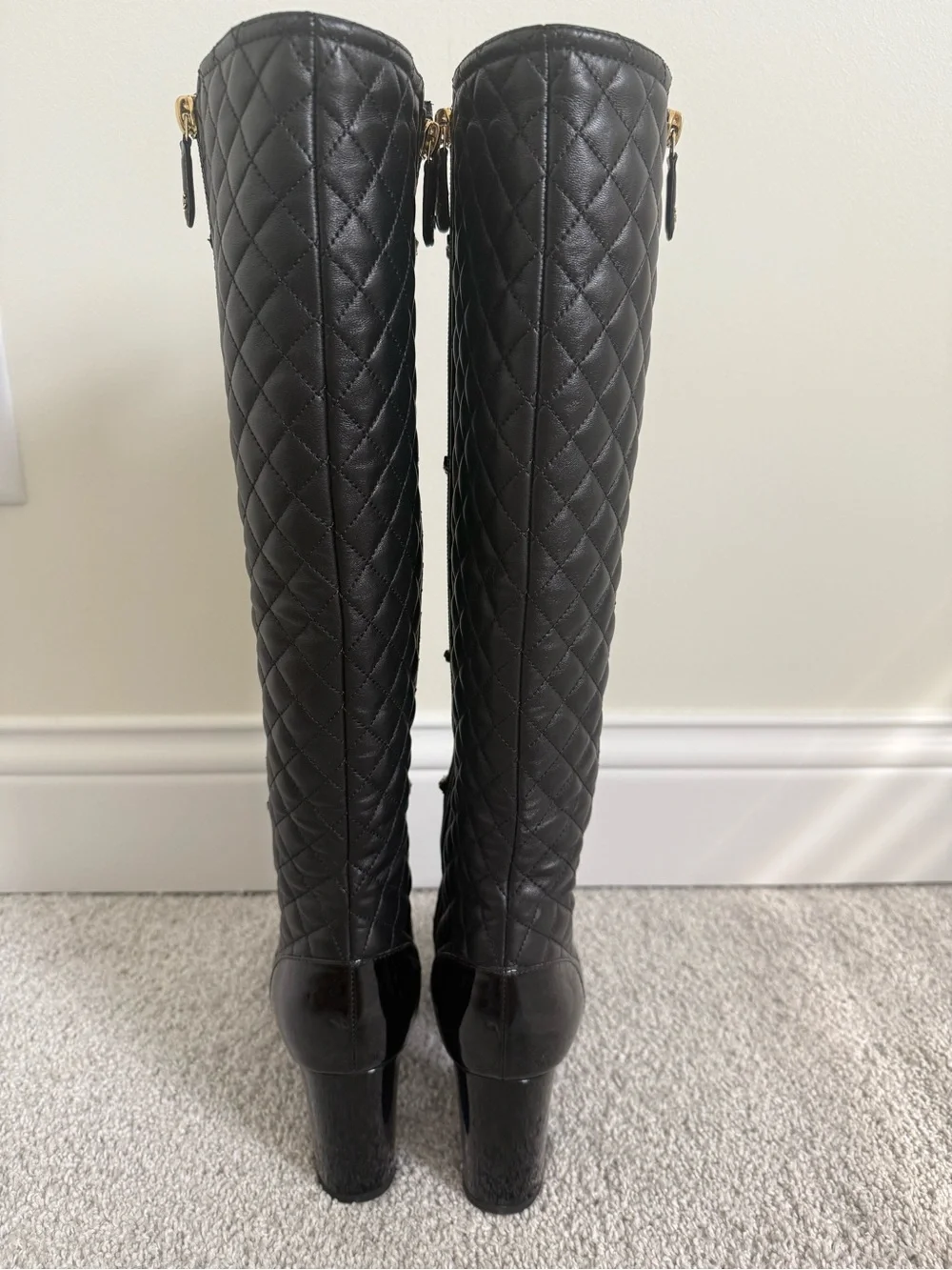 CHANEL Black knee-high lambskin leather boots